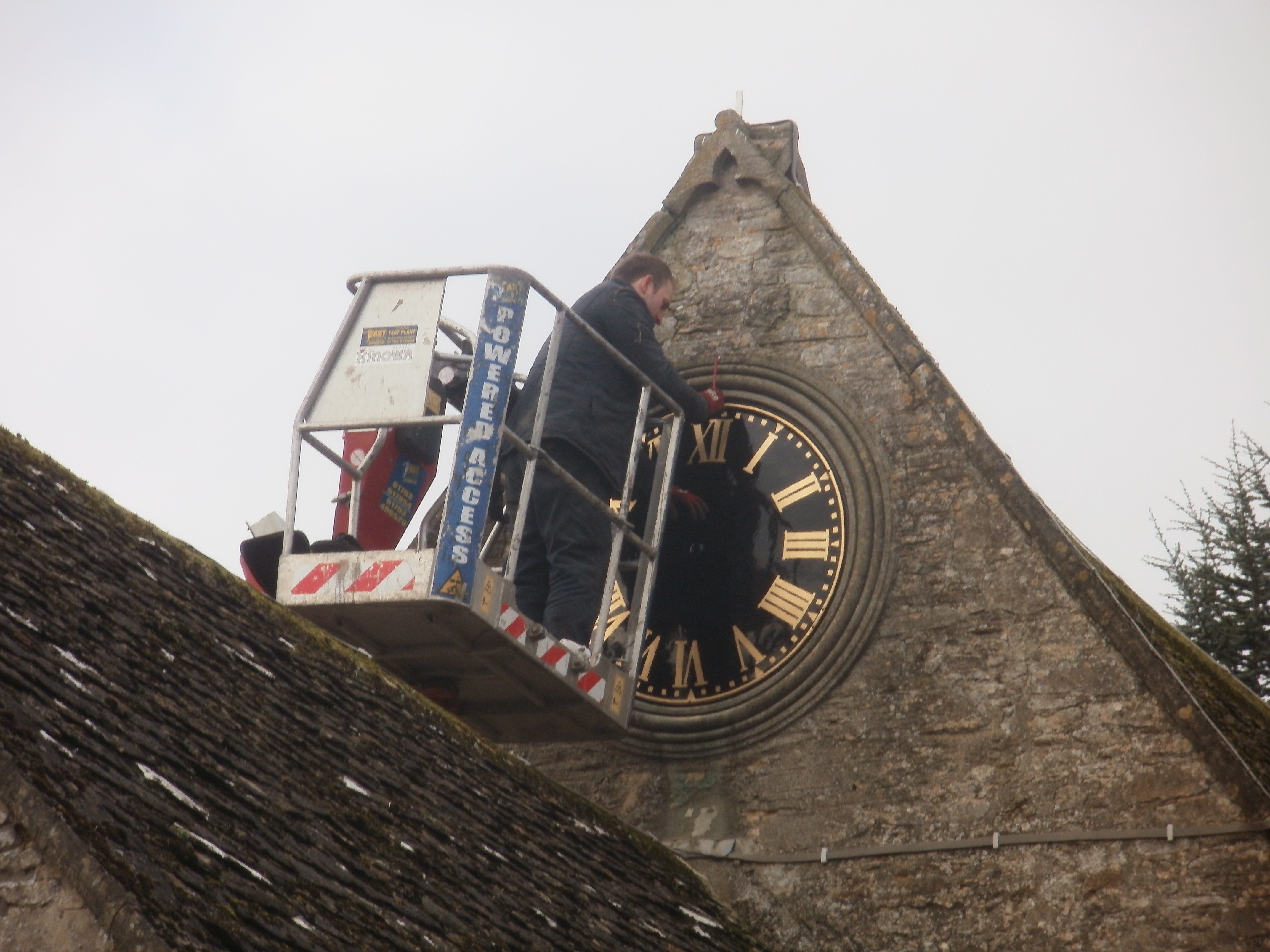 The refurbished face being installed.